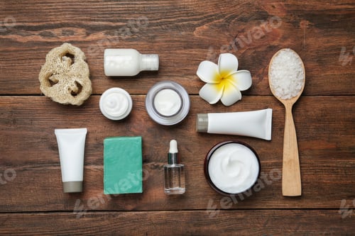 Preview: Flat lay composition with body care products on wooden background