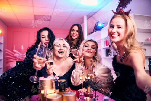 Preview: Jolly well-dressed ladies taking selfies in the office