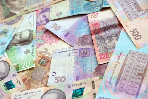 Preview: Ukrainian money bills close up. Big amount of hryvnia bills on table. Business and investment