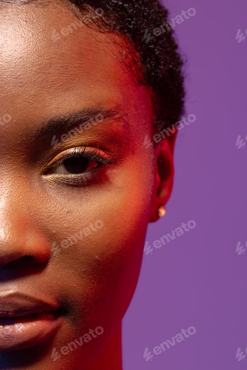 Preview: Half portrait of african american woman on purple background