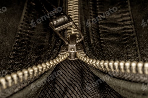 Preview: Closeup shot of a metal zipper on a black clothing