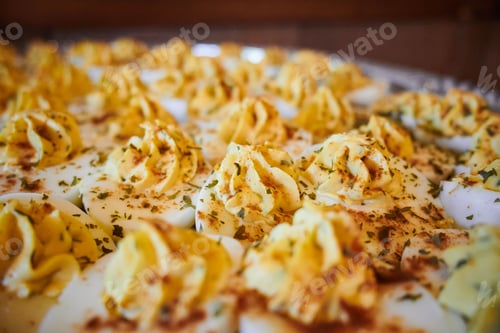 Preview: Selective focus of parmesan duchess potatoes seasoned with chopped greens with blurred background