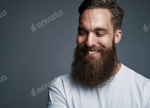 Preview: Happy young man with large fuzzy beard