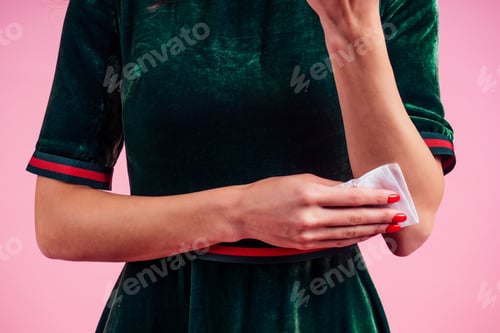 Preview: part of the body of a young woman in a pink studio