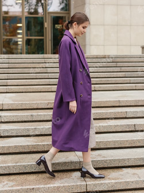 Preview: Happy business woman walking at beautiful autumn city street wearing colorful scarf and warm coat