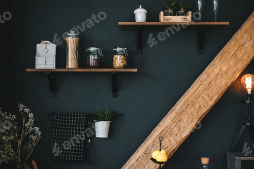 Preview: Pasta and grocery in glass jars on a wooden shelf in the kitchen. Detail