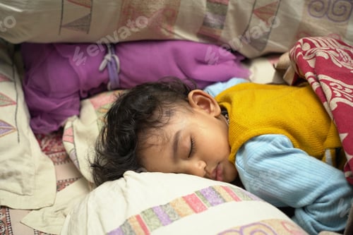 Preview: Closeup shot of an adorable baby sleeping in bed