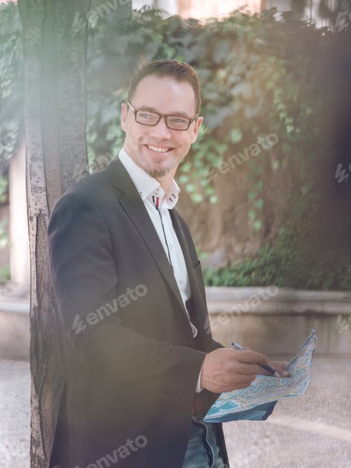 Preview: Businessman making notes on map