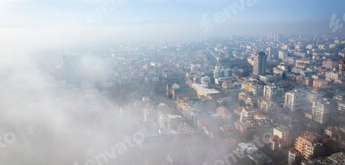 Preview: Fog clouds over the city from the sea, view from above