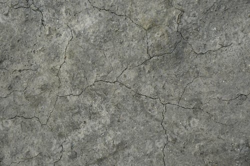 Preview: Dry textured ground surface as background, top view. Thirsty soil