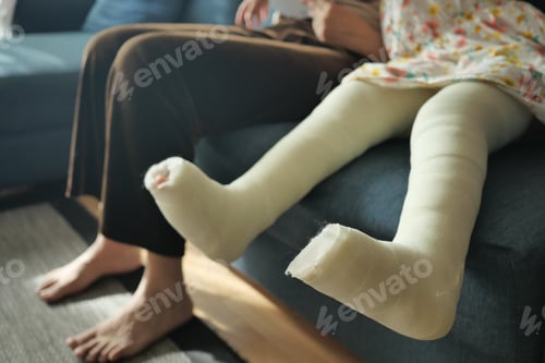 Preview: little child with plaster bandage on leg.