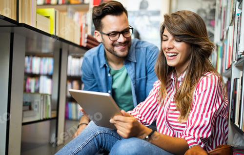 Preview: Group of college students studying in the school library
