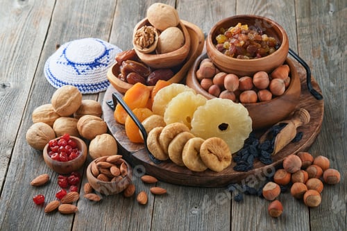 Preview: Tu Bishvat celebration concept. Mix of dry fruits and nuts almonds, hazelnuts, walnuts, apricots, pr