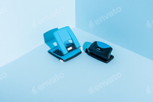 Preview: Blue Plastic Hole Puncher on Blue Background