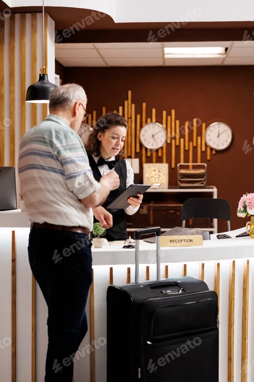 Preview: Receptionist helps old man with check-in