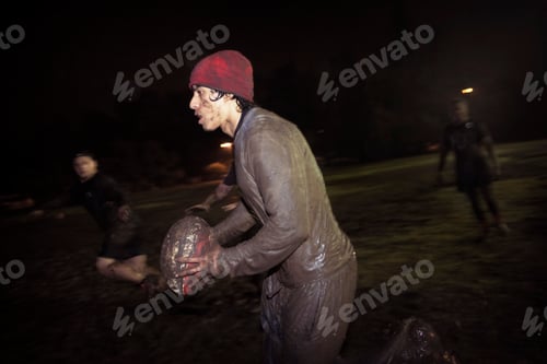 Preview: Muddy rugby match in full swing at night