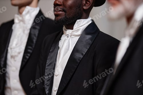 Preview: Diverse Group of Gentlemen in Row and Wearing Tuxedos