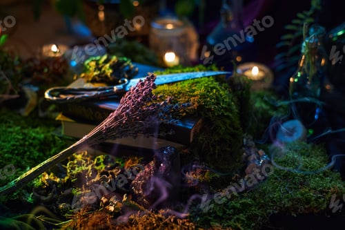 Preview: mystical tabletop scene features open books, dried herbs, and glowing candles