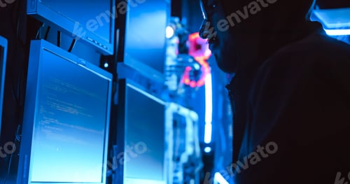 Preview: A male hacker is using a computer to hack data to demand ransom from victims.