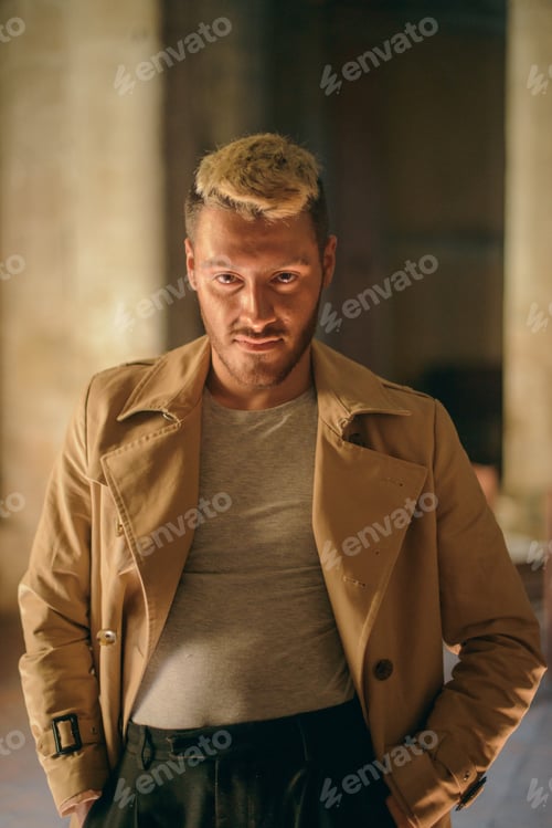 Preview: Confident man in light brown jacket
