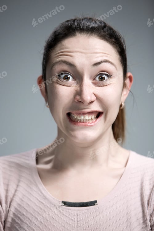 Preview: Portrait of young woman with shocked facial expression
