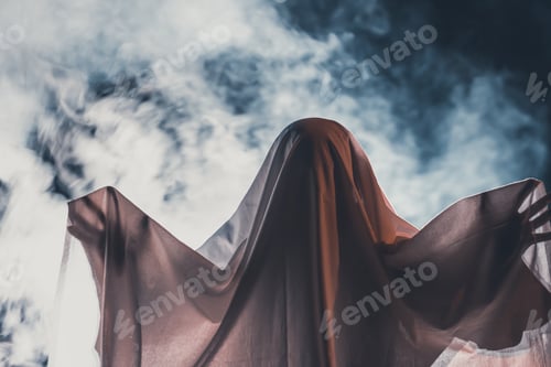 Preview: Halloween concept with ghost in smoky night