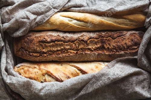 Preview: Baguette mix on a black background. French pastries, homemade