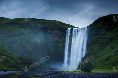 Preview: Skogafoss waterfall and grass covered mountains, Rangarvallasysla, Iceland