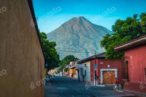 Preview: Colorful street in Antigua, Guatemala with Agua Volcano