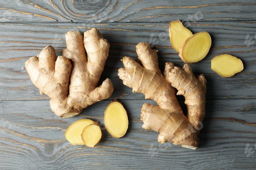 Preview: Fresh ginger on wooden background, top view