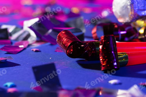 Preview: Close up of a party whistle on a purple background