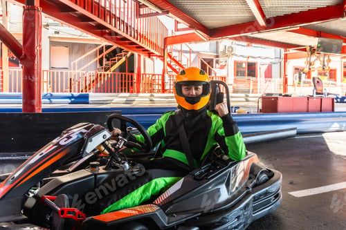 Preview: Man wearing go kart racing suit and helmet