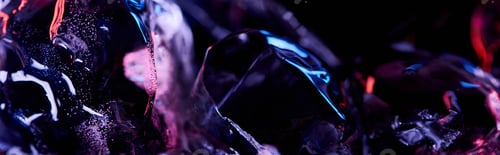 Vista previa: panoramic shot of transparent ice cubes with purple colorful lighting isolated on black