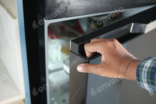 Preview: half open fridge with food and vegetables ,