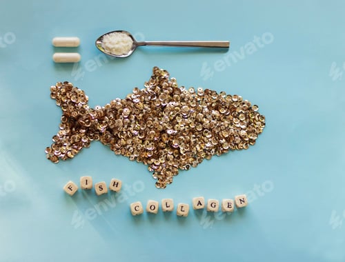 Preview: Fish collagen capsules and powder on trendy blue background.