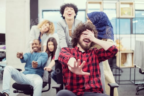 Preview: multiethnics business team racing on office chairs