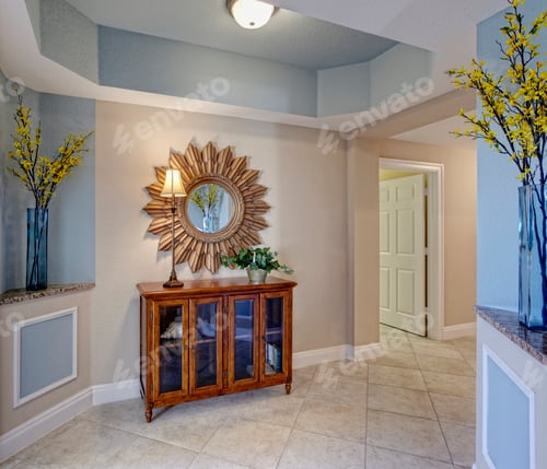 Preview: Condominium Interior, a hallway with display cabinet and sunburst style mirror, vases and flowers.