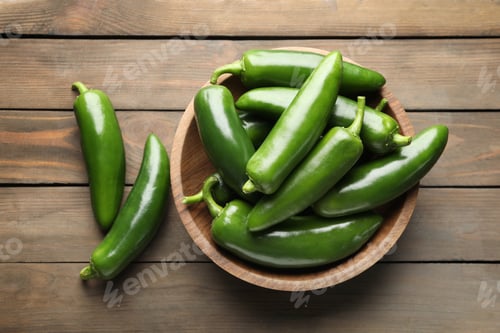 Preview: Fresh jalapeno peppers on wooden table, top view