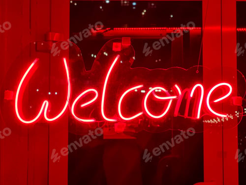 Preview: Closeup of red welcome neon sign hanging on the window of bar or night club