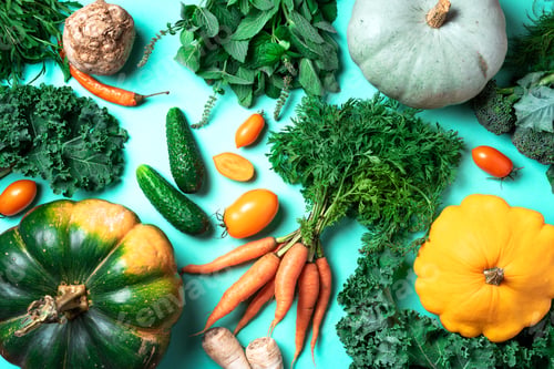 Preview: Autumn vegetables on trendy green background. Top view. Vegan and vegetarian diet, harvest concept