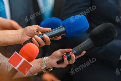 Preview: Microphones from news reporters, interview with a politician.