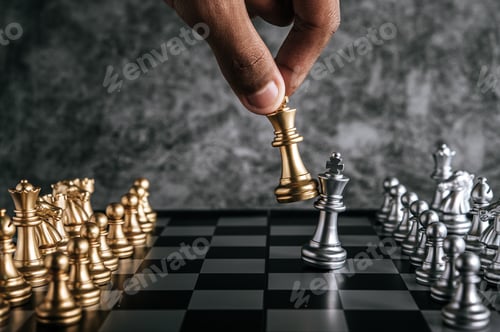 Preview: Hand of man playing chess for business planning and comparison of metaphor, selective focus