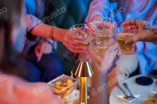 Preview: Young People Toasting with Glasses