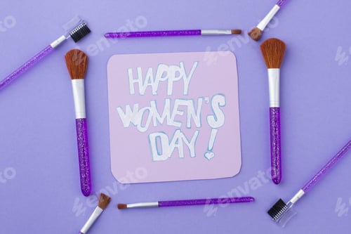 Preview: Happy women's day note in a frame made of layout brushes.