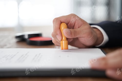 Preview: A Japanese male businessman who stamps his corporate seal on a document