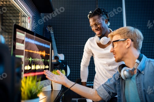 Preview: Young musician or producer showing African man group of sound waveforms