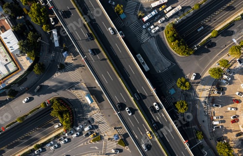 Preview: traffic is driving on a road with many cars and trucks