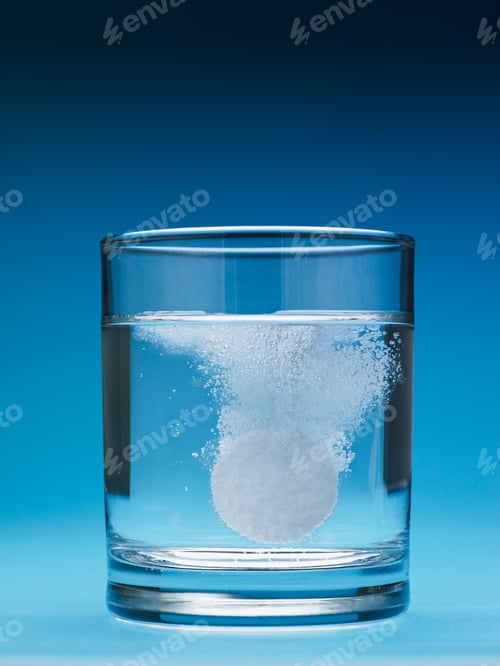 Preview: Painkiller Tablet Dissolving In Water Glass