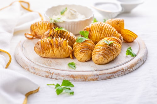 Preview: Traditional Swedish dish Hasselback potatoes with cream cheese dip
