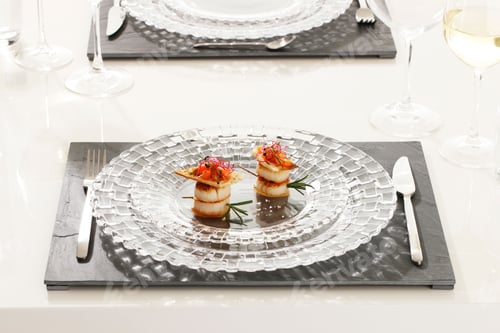 Preview: Beautifully served dish with scallops on a luxury glass plate
